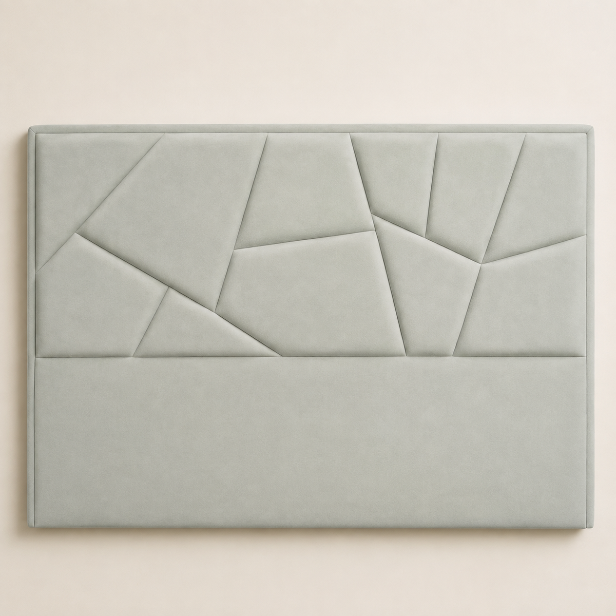 Close view of the SAKYNA light grey suede headboard with irregular geometric padded panels
