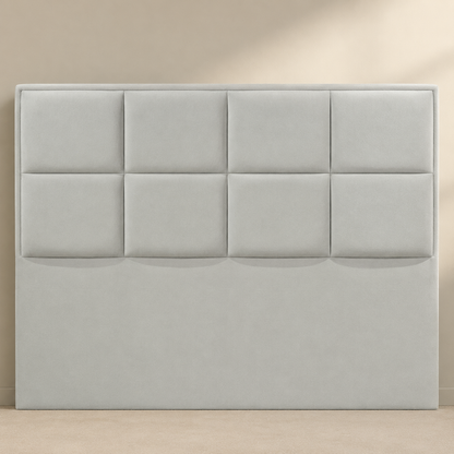 Close view of the AMYNA light grey suede headboard with eight broad padded panels