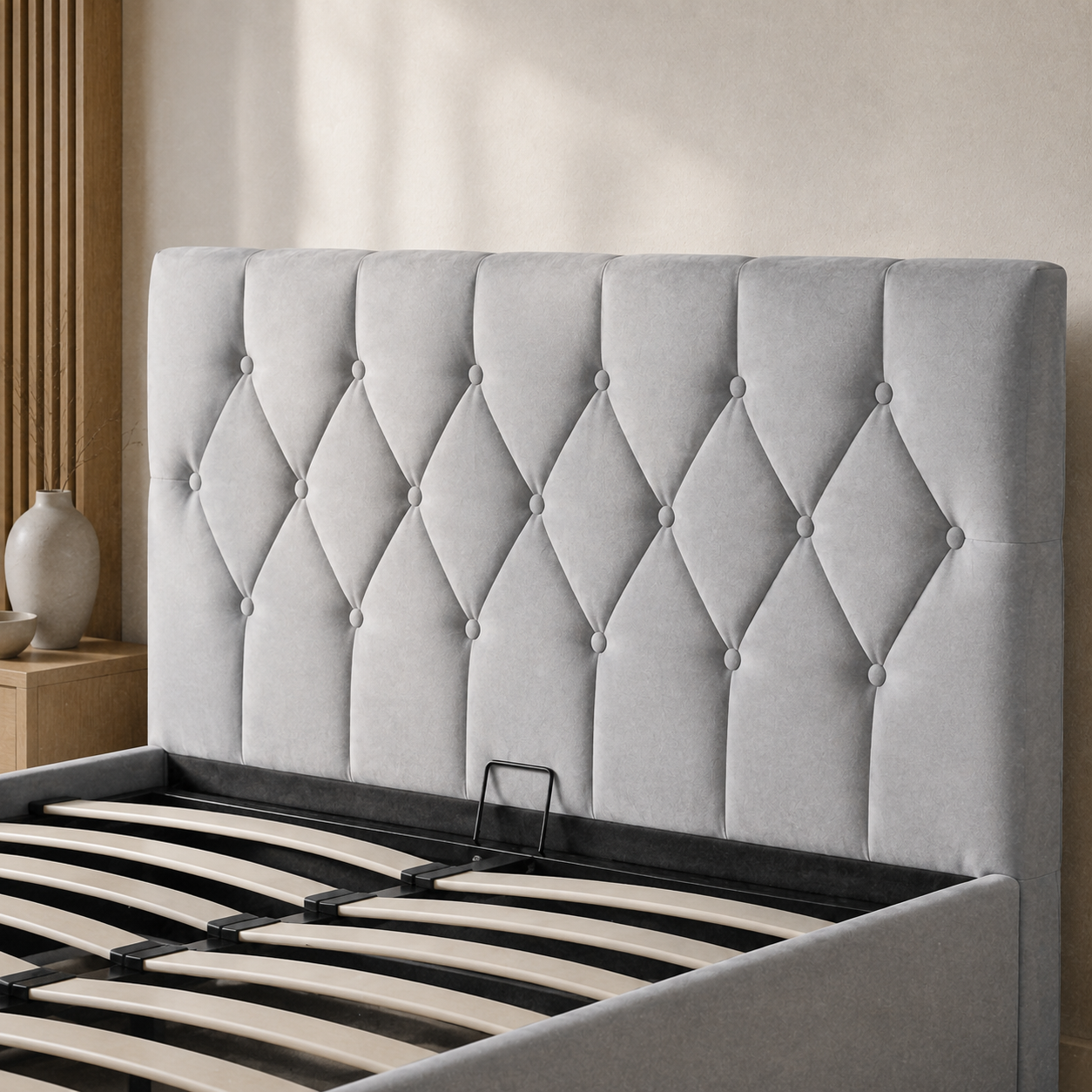 SAFA storage bed showing its curved wooden slats, black metal support frame and plain upholstered footboard