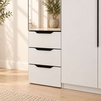 Detail of the AIDA vanity's three white drawers with black recessed pulls below its mirrored door
