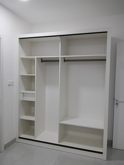 Actual AIDA 1.8 m interior with doors removed, showing two upper compartments, two hanging rails, left cubbies, one drawer and a lower shelf