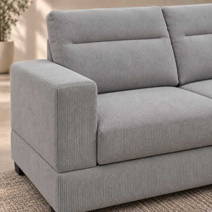 Close-up of the ribbed Grey corduroy upholstery and padded cushions on BELLAGIO