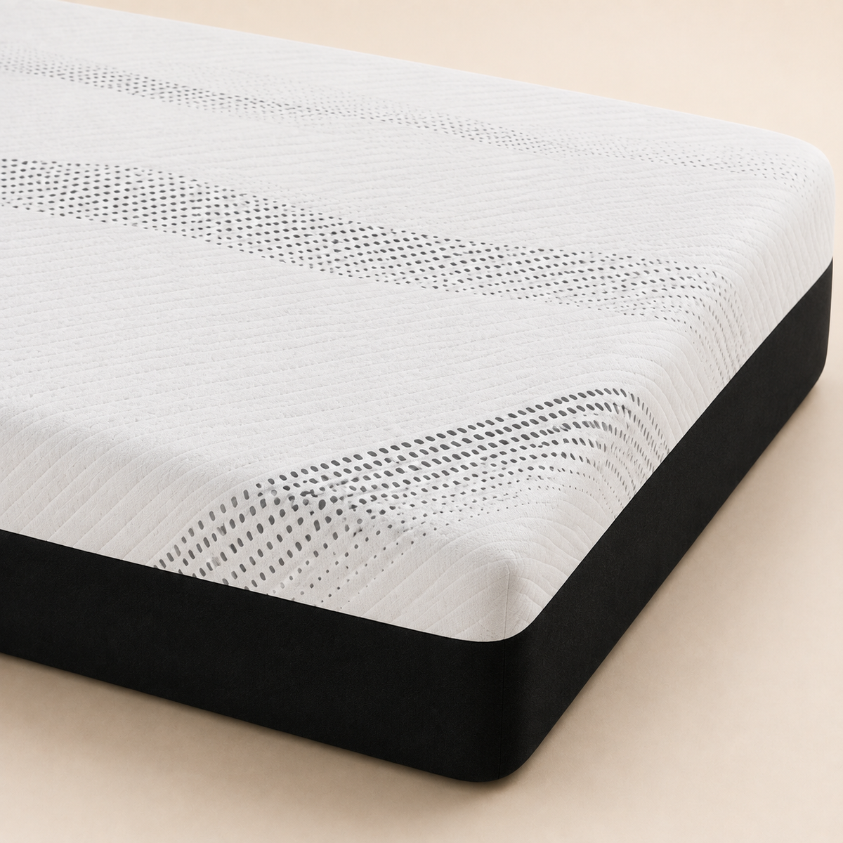 A close-up studio shot of a mattress corner showing a white textured top with a black side base on a light beige background.