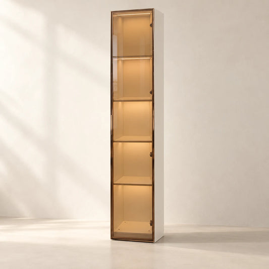 AIDA Gold LED glass cabinet with five illuminated display bays and a bronze frame, in a warm ivory studio — styling visualisation